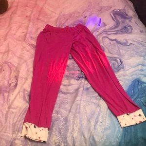 Pink and white pajama pants with designs